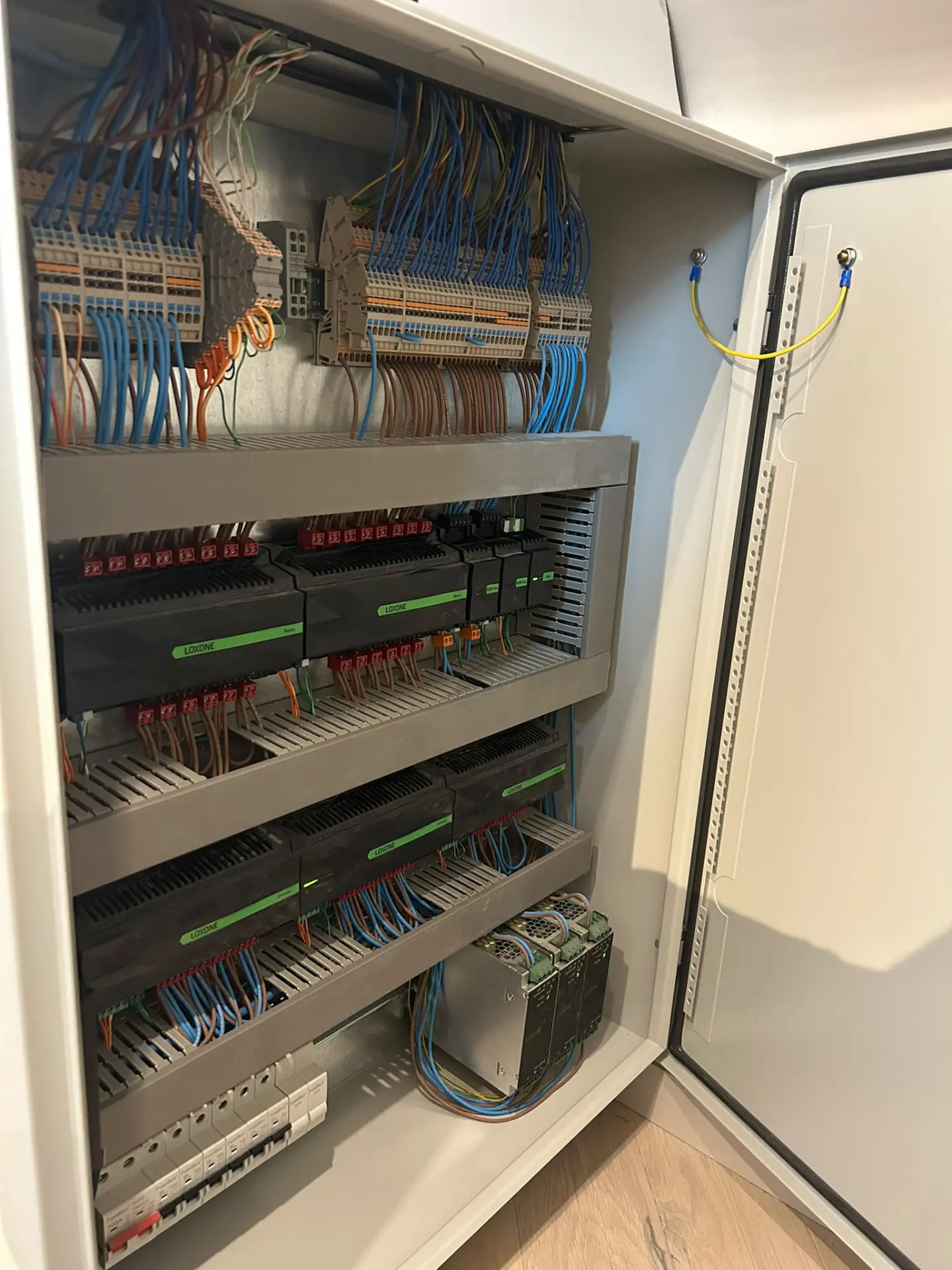 Loxone control panel with neatly dressed wiring, terminal rails and circuit protection installed by R Electrical Solutions