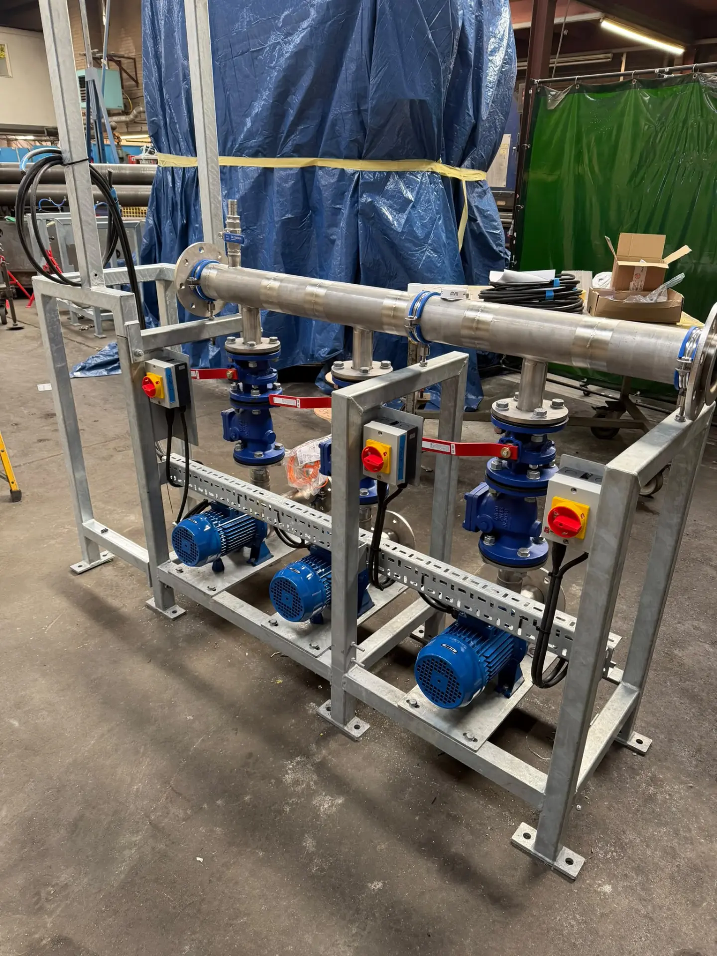 Skid-mounted pump set with three-phase motors, isolators and control wiring inspected and tested before commissioning